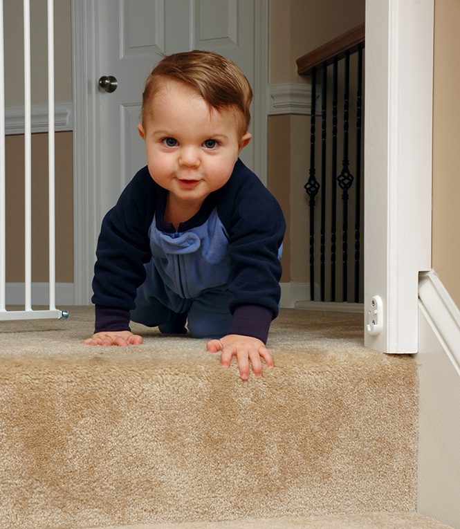 Crawling baby approaching stairs